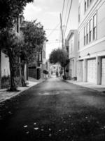 Grayscale alley way photo