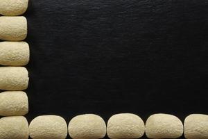 Potato crisps on slate background photo