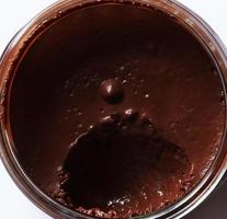 Eaten chocolate mousse in glass jar photo