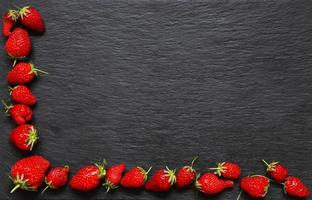Strawberries on slate background
