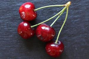 A bunch of cherries on slate photo