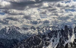 Snow-covered mountains in the Dolomites photo