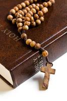 wooden rosary on the Bible photo