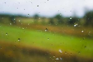 Raindrops on a train window pane. photo