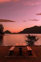 Picnic table at sunset photo