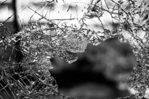 Grayscale of a broken window photo