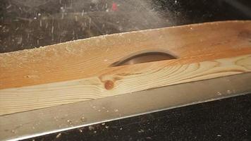 Circular saw sawing wood in a workshop video