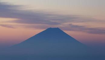 Top of Mountain Fuji and cloud at sunrise time photo
