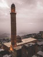 Mosque tower on cloudy day photo
