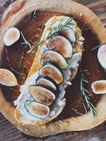 Top view of figs on wood slice photo