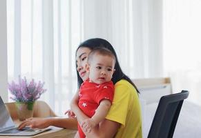 Mother working from home photo