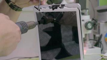 Tablet PC with broken touchscreen on repair service video