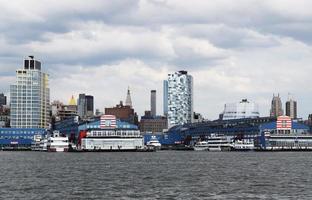 Ships on the sea near city buildings during daytime photo