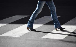 Person walking in pedestrian lane photo