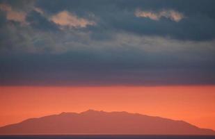 Cropped view of mountain during sunset photo