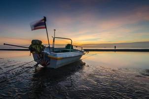 fishing boat on the huahin beach, Thailand photo