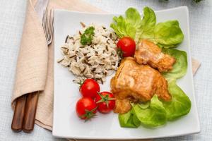 Grilled salmon fillet with rice and vegetables photo