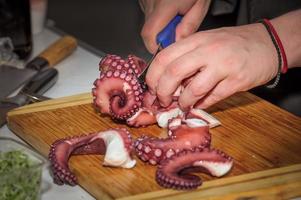 chef cutting octopus photo