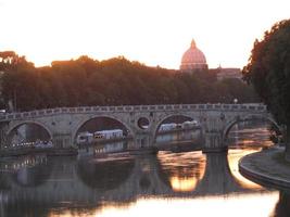Rome on river Tiber in the evening photo