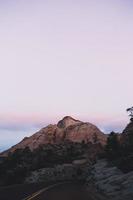 Setting sun over mountains photo