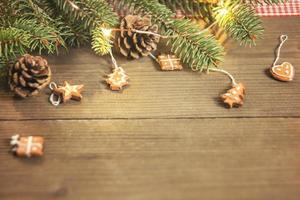 Christmas tree ornaments on wooden table photo