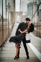 Attractive couple embraces in the city