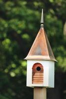 White and brown birdhouse photo