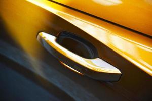 Yellow vehicle door lever photo