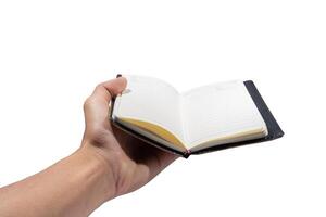 Open diary in the hand of a man photo