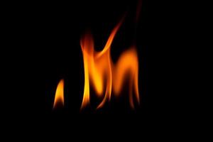 Close-up shot of flame on black background photo