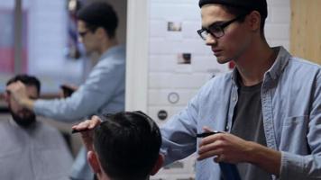 Combing of hair and styling in barber shop video