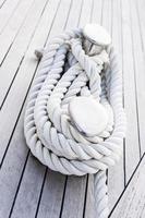 Rope tighten on Cleat. Hawser. Sailing Yacht. Deck.