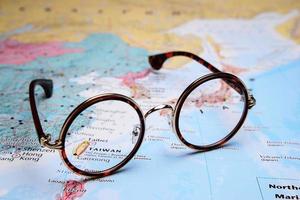 Glasses on a map of Asia - Taibei