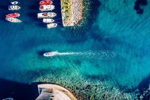 Aerial photography of colorful boats and yachts on tropical water