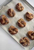 Breakfast pastries on a baking sheet photo