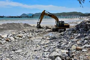 Man operating crawler excavator photo