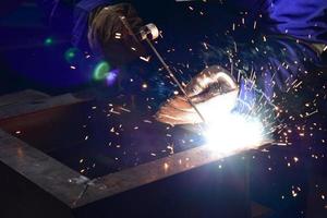 Welder in blue uniform photo