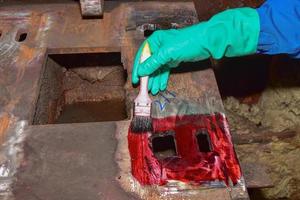 Welder applying penetrant photo