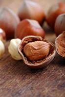 Hazelnuts, filbert on old wooden background photo