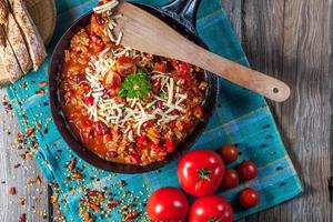 Chilli con carne with cheese. photo