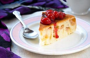 fresh apple charlotte cake with cherries in plate photo