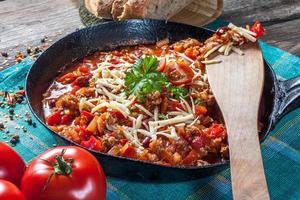 Chilli con carne with cheese. photo