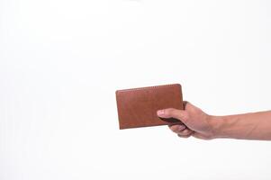 Holding a notebook on a white background photo