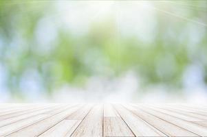 Wood floor on green bokeh background photo