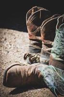 Two pairs of brown leather boots photo