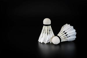 Badminton balls on black background photo