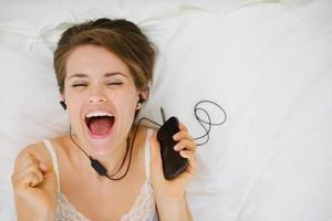 portrait of happy girl listening music