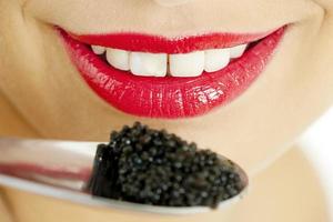 woman with black caviar photo