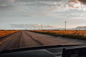 Setting sun on road photo