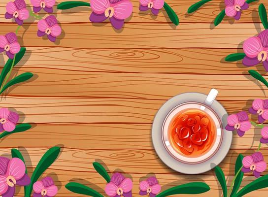 Top view of blank wooden table with tea and flowers